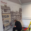 WallTex graphic being fitted on Bankfield Museum wall